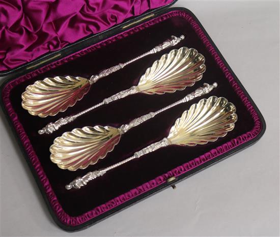 A cased set of four Victorian silver serving spoons with figural terminals, Edward Hutton, London, 1891, 8 oz.